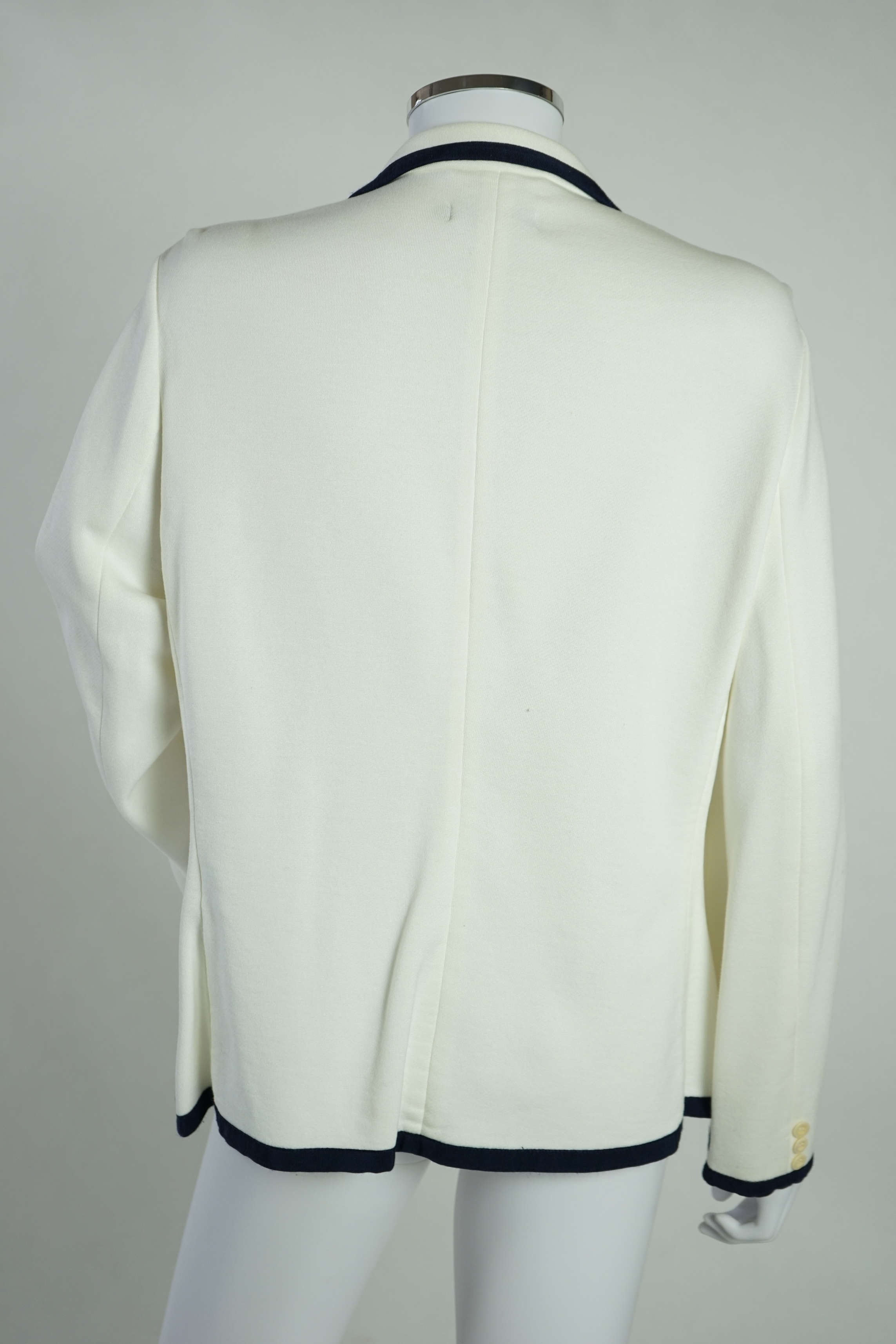 A cream Ralph Lauren blazer with navy blue cord piping. Proceeds to Happy Paws Puppy Rescue